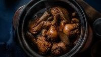 Chicken adobo in a clay pot
